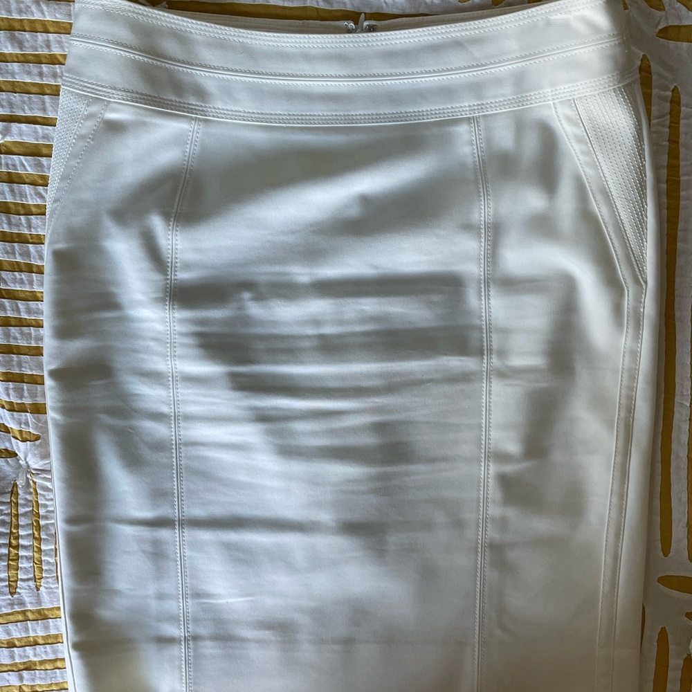 White pencil skirt with stitching details.